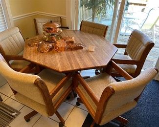 Retro octagonal table with 6 chairs on casters.  Great for dining or a game room!