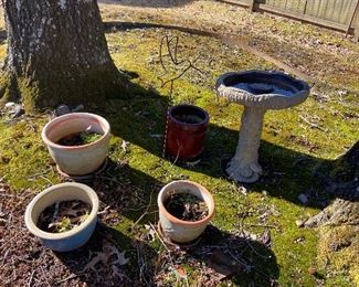 A few pots and a concrete bird bath.