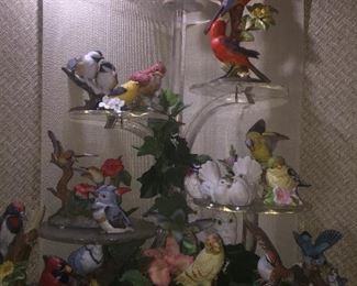 large menagerie of porcelain birds, many Goebel on cool lucite stand for the corner. Lucite stand $275