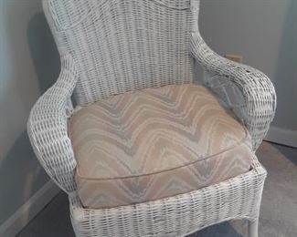 White wicker arm chair with cushions