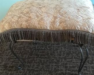 Metal bench with fringed pillow
