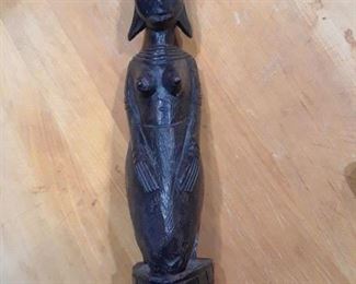 Ebony carved statue of a female figure, vintage