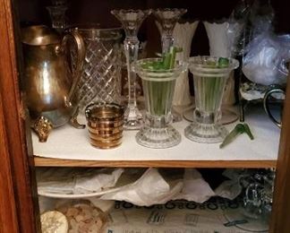 There are many closets and cabinets full of items. 