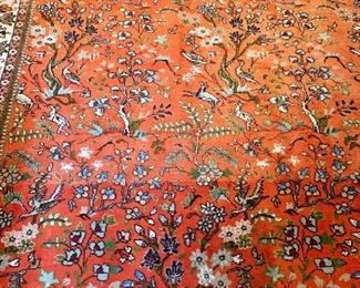$1,200 - Persian hand woven rug with animals and flowers; 10'2" x 7'6"