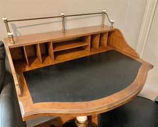 Pedestal writing desk with brass rail book gallery; 38.5" H x 29.25" W x 24" D