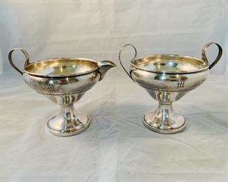 $150 - 20% OFF -  Footed sterling silver creamer and sugar bowl with M monograms and weighted bases; sugar bowl is 4" H x 4.5" W 