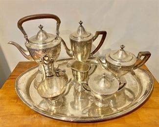 $11,600 - 20% OFF - Tiffany & Co. Sterling Silver seven piece tea and coffee service with D monogram. Coffee pot is 10.5" H/two pints. Teapot on chafing stand is 12.5" tall. Tray is 24.5" x  16.25" 