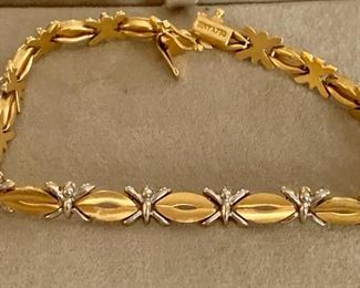 $600 - 20% OFF -  18K yellow and white gold bracelet with slide safety clasp; approx 7.5" long; marked SIMYA 750