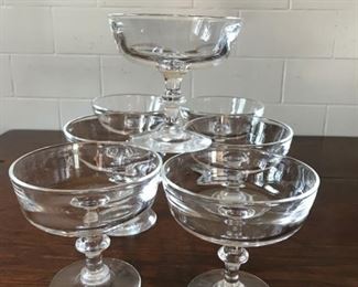 Price: $175. Steuben signed coupes - 7 heavy glasses in all. Condition is excellent without any chips, nicks or cracks. Measure: 4"H x 4"W x 2.5"Base 