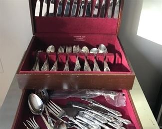 Price: $2,500. 106 pieces - Wallace Sterling Rose Point pattern in own silver case. Includes 96 flatware pieces / 10 serving pieces. Flatware weighs 6 lbs. excluding knives, spreaders and carving set.