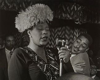 1100
William Paul Gottlieb
1917-2006, American
Ella Fitzgerald With Dizzy Gillespie, Ray Brown And Milt Jackson At The Downbeat Club, NYC, 1947
Black and white photograph on paper under glass
Signed lower left: William P Gottlieb, and with the copyright symbol
Sight: 13.25" H x 10.25" W
Estimate: $500 - $700