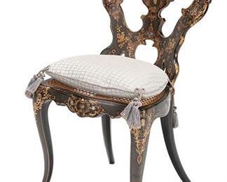 2014
A Papier-Mâché Side Chair
Mid-19th Century
The black lacquered chair painted and decorated with gilt and mother-of-pearl inlay throughout, with inlaid mother-of-pearl cameos to the crest rail and pierced splat, atop a caned seat with tasseled cushion raised on saber legs
32.5" H x 16.25" W x 15" D
Estimate: $500 - $700
