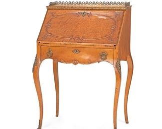 2015
A Drop Front Ladies Desk
First-quarter 20th Century
The mounted maple-veneered desk with raised wood designs and an open-work gilt-bronze gallery edge over a drop front writing surface and a fitted interior containing two drawer compartments and pigeonholes atop one long drawer raised on cabriole legs with sabots
40.25" H x 27.5" W x 18.25" D
Estimate: $500 - $700