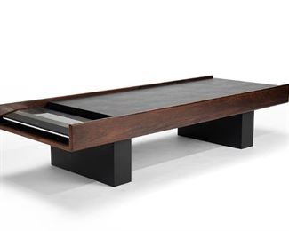 2029
John Scott
Late 20th/early 21st Century, American
Custom Designed Low Table In Dark Walnut And Textured Black Vinyl With Bang & Olufsen Beomaster 4500 Stereo System
Walnut and laminate
15.25" H x 72" W x 27" D
Estimate: $500 - $700
