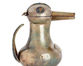2036
A Los Castillo Silver And Mixed-Metal Water Pitcher
Third-quarter 20th Century; Taxco, Mexico
Marked for Los Castillo; Further marked: Plateado
In the form of a long-beaked bird with hinged lid for a head over a bulbous body issuing an inlaid tail/handle
11" H x 10.5" W x 7.5" D
Estimate: $100 - $200