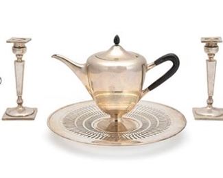 2043
A Group Of American Sterling Silver Items
First-half 20th Century
Each marked for sterling; Various makers
Comprising a Towle Silversmiths tea set with a tea pot, sugar bowl, and creamer, a pair of Watson Company weighted candlesticks, and a Lawrence B. Smith Co. reticulated plate on a raised foot, 6 pieces
Largest: 1.25" H x 11" Dia.
25.630 oz troy approximately
Estimate: $600 - $900