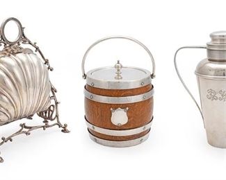 2044
A Group Of English And American Silver Plated Items
Late 19th/mid-20th Century
Various makers marks
Comprising a Hammond, Creake & Co. wood and porcelain-lined biscuit barrel/ice bucket (6.5" H x 5.25" Dia.), an Alexander Clark & Co Ltd. shell form folding biscuit box (10.375" H x 7.875" W x 6" D), and an American 1930s-style cocktail shaker (9" H x 4.5" Dia.), 3 pieces
Estimate: $300 - $500