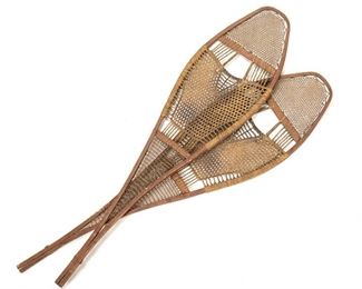 2050
A Pair Of Huron-Style Snowshoes
First-quarter 20th Century
The wooden tear drop-shaped snowshoes with babiche netting and extending tail, 2 pieces
.75" H x 40.5" W x 10.625" D
Estimate: $300 - $500