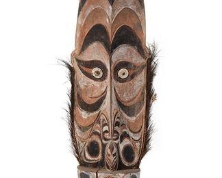 2055
A Large Teket Ceremonial Orator's Stool
Circa 1960s; Iatmul people, Sepik river region, Papua New Guinea
The figural carved wood stool painted with natural pigments, inset shell eyes, and trimmed with cassowary bird feathers
41.25" H x 12.5" W x 8.5" D
Estimate: $300 - $500