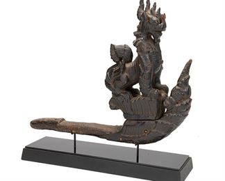 2062
A "Chinthe" Vehicle Protection Figure
First-quarter 20th Century; Myanmar (Burma)
The carved lacquered wood figure depicting a chinthe, possibly at the prow of a ship
13.5" H x 16.25" W x 3.5" D; Overall: 16.25" H x 16.5" W x 4.75" D
Estimate: $300 - $500