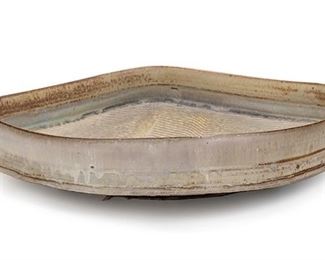 2077
A Mid-Century Modern Japanese Charger
20th Century
The square glazed ceramic charger with rounded corners decorated with low relief waved lines
4" H x 18.25" W x 18.25" D
Estimate: $400 - $600