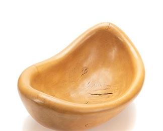 2081
A Carved Maple Free-Form Bowl
Second-half 20th Century
Signed to underside with unknown maker's mark
The smooth ovoid-form center bowl with fluctuating rim
9.75" H x 19.5" W x 12.75" D
Estimate: $200 - $300