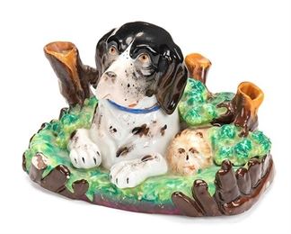 2102
A Staffordshire Porcelain Pen Holder
Fourth-quarter 19th Century
Depicting a seated dog and cat in underbrush
4" H x 6" W x 3.625" D
Estimate: $300 - $500