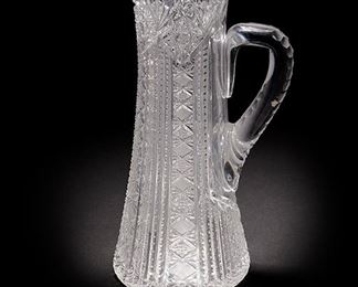 2110
An American Brilliant-Cut Glass Pitcher
Late 19th/early 20th Century
Apparently unmarked
The tall heavy pitcher with sawtooth rim and curved faceted handle
14" H x 8" W x 5.875" D
Estimate: $300 - $400