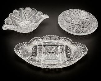 2111
Three American Brilliant-Cut Glass Items
Late 19th/early 20th Century
Comprising a round plate (1.75" H x 11.5" Dia.), a banana bowl (4" H x 13.25" W x 8.5" D), and an ice cream tray (1.875" H x 17.25" W x 10.125" D), each with sawtooth edges, 3 pieces
Estimate: $400 - $600