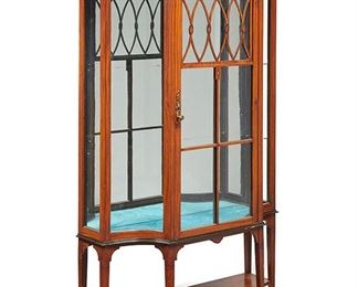 2120
A Satinwood Vitrine Cabinet
First-quarter 20th Century
With satinwood inlays, mirrored back, teal velvet floor, and glazed single door and sides
75" H x 40" W x 14" D
Estimate: $800 - $1,200