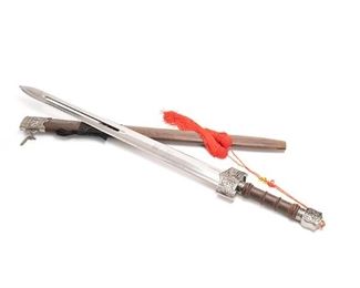 2134
A Chinese Jian
Second-half 20th Century
The replica Warring States Period double-edged sword with wood scabbard and decorated metal mounts and hilt
36" H x 3.5" W x 1.25" D
Estimate: $150 - $250