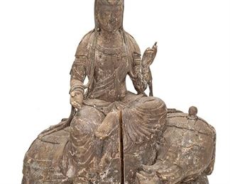 2137
A Chinese Carved Wood Guan Yin Figure
19th Century or earlier
Depicting the Goddess of Mercy with downcast eyes in meditation performing the Karana Mudra seated atop an elephant
18" H x 15.25" W x 10" D
Estimate: $300 - $500
