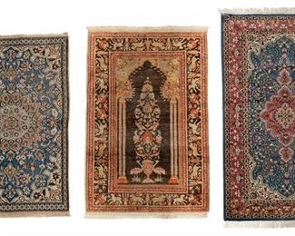 2142
Three Persian-Style Rugs
20th Century
Comprising one wool on cotton foundation with floral motifs and central medallion on blue and red field (61.5" L x 36" W), one wool on cotton foundation prayer rug with floral and figural motifs on brown field (55" L x 36" W), and one wool on cotton foundation with floral motifs and central medallion on blue field (52" L x 35" W), 3 pieces
Estimate: $200 - $400