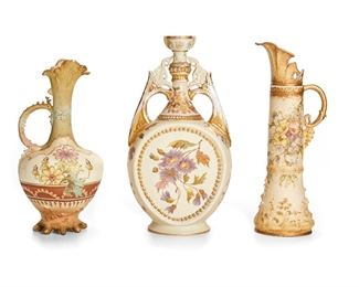 2148
Three Art Nouveau Vases
Late 19th/early 20th Century
Two marked for Riessner, Stellmacher & Kessel Turn-Teplitz; One marked for Rudolstadt, Straus & Sohne
Comprising two Bohemian Amphora pitchers with fluted vacillating spouts, and a German double-handled vase with a thin central spout and flattened-circular body, 3 pieces
Tallest: 13.5" H x 7.25" W x 4.5" D
Estimate: $300 - $500