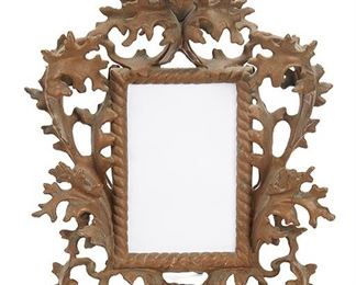 2149
A Spelter Picture Frame
Late 19th/early 20th Century
With raised and scrolling foliate design
12.75" H x 10" W x 3.75" D
Estimate: $100 - $200