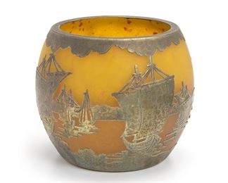 2155
A Metal Overlay Art Glass Vase
First-quarter 20th Century
Depicting ships in a harbor
5.125" H x 6" Dia.
Estimate: $200 - $400