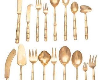 2174
A Thai Gilt-Bronze Flatware Service
Third-quarter 20th Century
Each marked
Each with bamboo motif, comprising 8 place knives (8.875"), 8 steak knives (8.25"), 8 butter spreaders (5.75"), 7 place forks (7.75"), 8 luncheon forks (7.25"), 8 cocktail forks (7"), 8 dessert forks (6"), 8 place spoons (7.75"), 8 teaspoons (6"), 8 demitasse spoons (4.75"), 8 iced tea spoons (7.5"), 1 carving knife (11.25"), 1 carving fork (10.25"), 1 serving fork (9.75"), 1 serving spoon (10.5"), 1 salad serving fork (9"), 1 salad serving spoon (9.5"), 1 pickle fork (7.25"), 1 berry spoon (9.125"), 1 cake knife (10.5"), 1 pie server (10.5"), 1 cheese knife (6"), and 1 cuillere a arroser (5.25"), 99 pieces
Estimate: $300 - $500