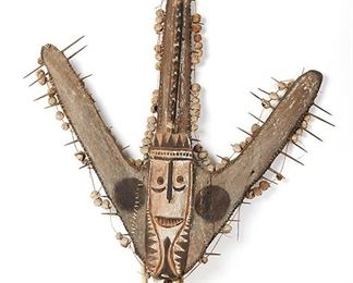 2180
An Oceanic Canoe Prow
20th Century; Papua New Guinea, Sepik River
A triadic shield-like ornament, designed with sago spathes, pigment, wood, raffia, and cane
64.5" H x 49" W x 5.5" D
Estimate: $100 - $200