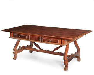 2189
A Large Spanish Trestle Table
19th Century
The large rectangular top over two shallow drawers, carved legs and stretchers
30.75" H x 78" W x 38.5" D
Estimate: $1,200 - $1,800