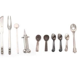 2191
A Group Of Silver Table Accessories
First-half 20th Century
Most marked for sterling
Of various makers comprising one Allan Adler "Starlit" butter spreader (6"), one Allan Adler cocktail stirrer (3.875"), one Mexican cheese knife (5.125"), one Mexican cocktail fork (5"), one Carmen Beckmann butter knife (6.625"), four Mexican salt spoons (3.75"), three Kenneth Begay with White Hogan salt spoons (2.25"), two Georg Jensen and Wendel salt spoons (2.125"), and one Hector Aguilar "Rope" corn holder (3"), 15 pieces
7.3 oz. troy approximately
Estimate: $200 - $300
