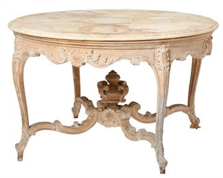 2193
A Louis XV-Style Round Library Table
Late 19th/early 20th Century
The beech wood table with marble top above a carved apron raised on cabriole legs with ornamented ogee stretcher
30" H x 46.5" Dia.
Estimate: $300 - $400