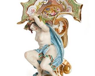 2203
An "Old Paris" Painted Figural Tazza
Late Second Empire, circa 1860; France
The nude female figure holding a decorative shell
17.5" H x 12" W x 7.5" D
Estimate: $400 - $600