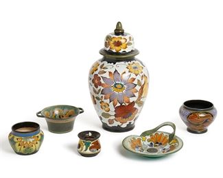 2216
Six Gouda Holland Objects
20th Century
Each signed to base
Comprising a lidded jar, a handled dish, a candlestick, and three vases, 6 pieces
Largest: 14.325" H x 7.25" Dia.
Estimate: $100 - $400