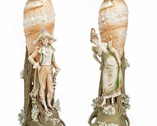 2218
An Opposing Pair Of RStK Amphora Shell Vases
Circa 1892-1905; Teplitz, Austria
Each marked for Riessner, Stellmacher & Kessel Turn-Teplitz; Further marked: 1138 / 8
The opposing male and female figures each with a large shell and floral base, 2 pieces
Each approximately: 26.5" H x 8" W x 11" D
Estimate: $1,200 - $1,800