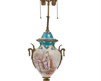 2221
A Sèvres-Style Table Lamp
Fourth-quarter 19th Century
With Sevres-style mark to underside
Celeste blue and painted classical scenes on white porcelain body with bronze mounts
33" H x 11.5" W x 8.5" D
Estimate: $600 - $800