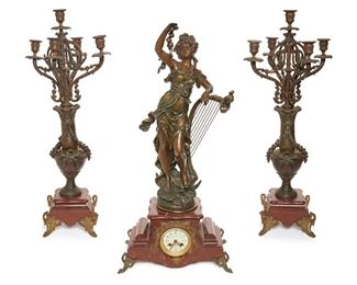 2222
A French Mantle Clock And Garniture Set
First-quarter 20th Century
Dial signed: Fernand Venezet Mazanet; Figure signed: Chanet Du Crepuscule after F. Moreau; Movement signed: Japie Freres / Medaille D'Honneur
Spelter figure with harp over a clock set in a marble base together with two spelter five-light candelabra, 3 pieces
Clock: 31.75" H x 15" W x 8.5" D; Each candelabra: 28" H x 12.5" W x 12.5" D
Estimate: $800 - $1,200