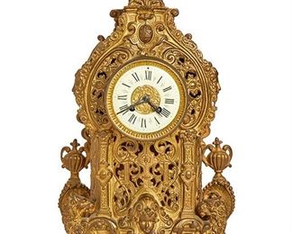 2228
A French Gilt-Bronze Mantle Clock
Fourth-quarter 19th Century
Marked to movement: 6351
The reticulated body with C and S-scrolls enclosing a porcelain dial with black Roman numerals and brass repousse inner ring under a floriate finial and flanked by Classical female heads and urns set on griffin feet
19.5" H x 10.75" W x 5" D
Estimate: $600 - $800