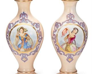 2235
A Pair Of Continental Porcelain Portrait Vases
19th Century
Each baluster-form centering a portrait of a woman in traditional costume encircled by a blue and red interlace border and interlace medallions on the reverse with gilt decoration throughout on a light pink ground, 2 pieces
16.5" H x 6.5" Dia.
Estimate: $400 - $600