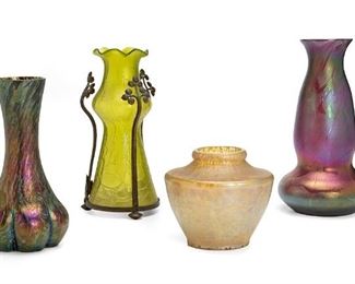 2244
Four Loetz Iridescent Glass Vases
Late 19th/early 20th Century
Shortest signed for Loetz: [Arrows] / Austria
Comprising two multi-color purple vases with bulbous bases and tapered necks, one green vase with ribbon rim, graduated neck and bronze floral three-armed mounting, and one light-toned squat vase with wide shoulder and tapered base
Tallest: 10.75" H x 5.5" Dia.; Shortest: 5.5" H x 5.75" Dia.
Estimate: $400 - $600
