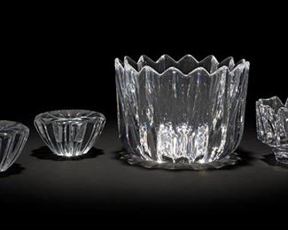 2249
Four Orrefors Clear Art Glass Table Items
Second-quarter and third-quarter 20th Century
Three signed: Orrefors; Larger bowl further numbered: JJ 461413
Comprising a large bowl with zig-zag rim and cut sides, a floriform bowl, and a pair of floriform candleholders, 4 pieces
Largest: 5.625" H x 7.5" Dia.
Estimate: $300 - $500